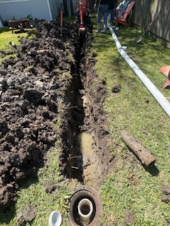 Line replacement by Livas Contracting Services, Katy TX: Trench cut, new pipe staged